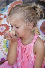 Girl eating a healthy fruit snack