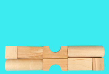 Wooden toy blocks on blue background