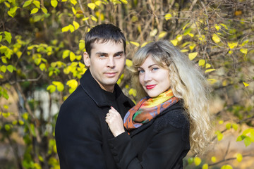 Fototapeta premium Portrait of a boy and a girl in the autumn park