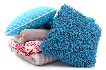 Colorful pillows and plaids isolated on white
