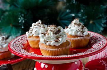 Christmas cupcakes with whipped cream and chocolate