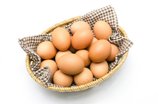 Egg in a basket with brown cloth.
