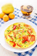 Omelet with paprika, tomato and herbs