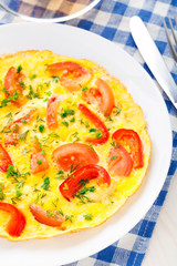 Omelet with paprika, tomato and herbs