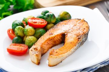 Salmon with roasted brussels sprout and tomato