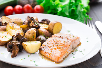 Roasted salmon with potatoes and mushrooms