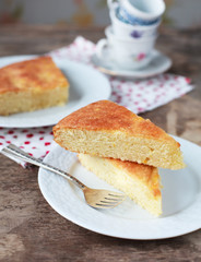 A piece of traditional Greek yoghurt cake Yaourtopita with orang