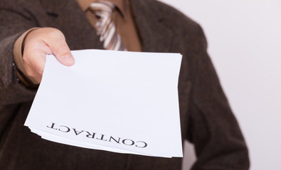 Businessman giving blank paper with sign contract