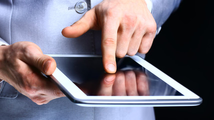 man holding digital tablet, closeup