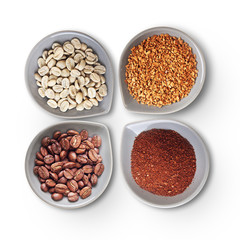 Bowls with green, roasted coffee beans, ground and instant