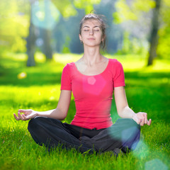 Young woman doing yoga exercises