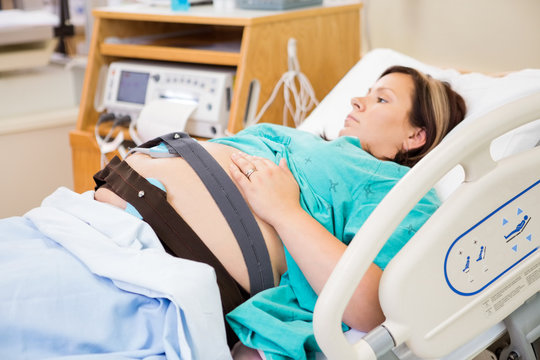 Birthing Woman with Electronic Fetal Monitor Attached
