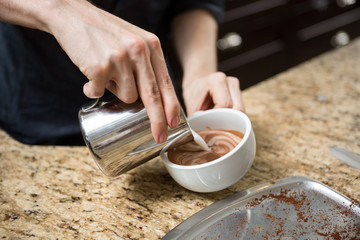 Barista Making Cappuccino In Coffeeshop