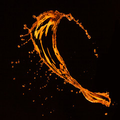 orange water splash isolated on black