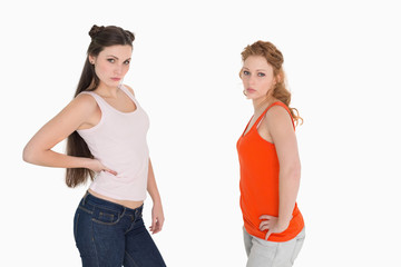 Unhappy female friends not talking after argument