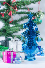 Christmas toys on a fir-tree branch isolated on white background