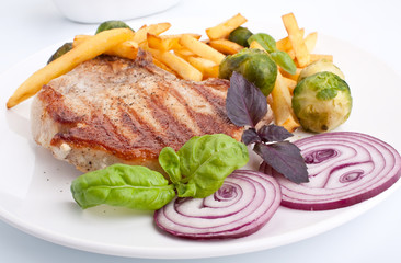 pork chops with french fries and brussels sprouts