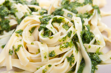 Tagliatelle with spinach on plate
