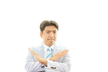 禁止の意思表示をするビジネスマン