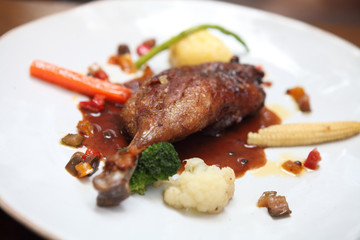 Duck confit , Roasted duck with blueberry sauce