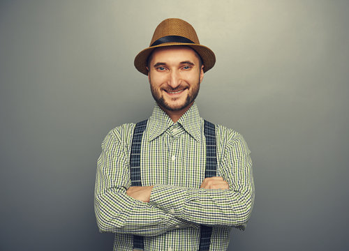 smiley hipster man over grey background