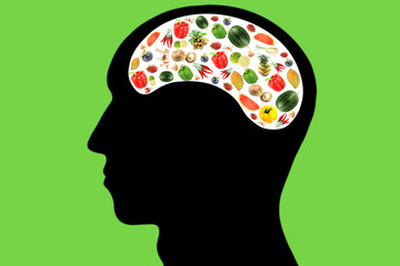 Vegetables and fruits in Head on green Background.