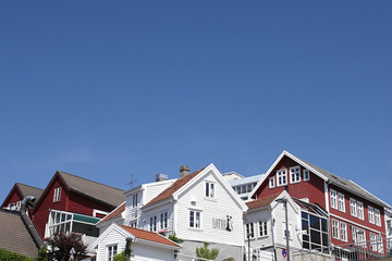 Fototapeta na wymiar Typical norwegian red and white wooden houses with roof