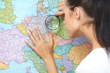 woman looking at world map