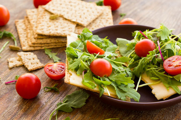 Vegetarian crispbread  with tomatos, cheese and salad mix