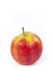 Round red and yellow apple over a white background