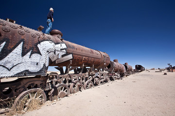 man at Train Cemetery at Uyuni, Bolivia.