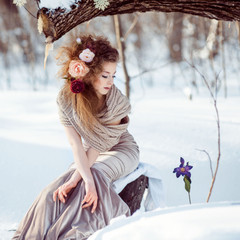 beautiful girl in the winter forest