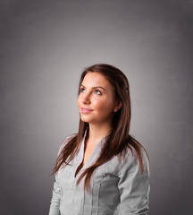 Young woman standing and thinking with copy space