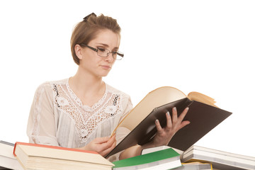 woman in glasses reading lots of books