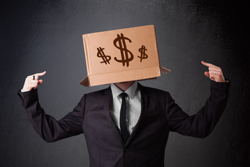Young man gesturing with a cardboard box on his head with dollar