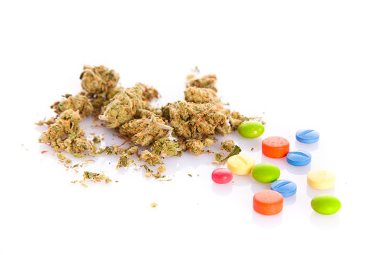 marihuana and pills isolated on white background