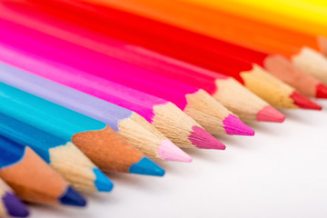 Colored Pencils Row On White Background