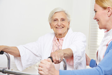 Senior woman with geriatric nurse