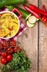 Vegetable casserole in a red pot