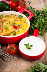 Vegetable casserole in a red pot