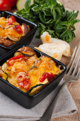 Two dishes of vegetable casserole