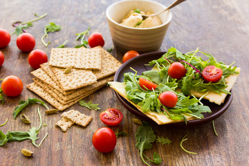 Vegetarian crispbread  with tomatos, cheese and salad mix