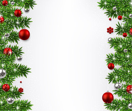Christmas background with fir branches and balls.