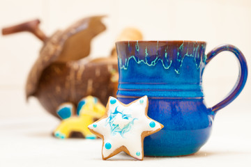 Blue mug and christmas gingerbread cake star icing decoration