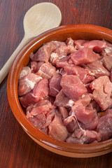 pieces of fresh pork meat ready for cooking in the crock pot