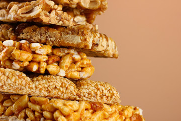 tasty sweets (kozinaki), on brown background