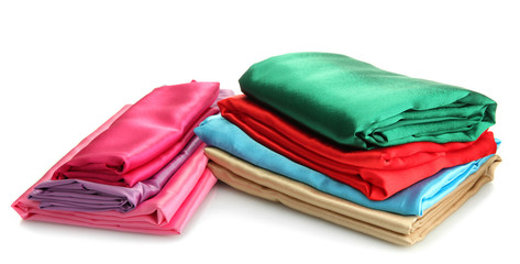 heap of cloth fabrics isolated on white