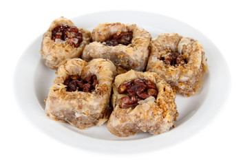 Sweet baklava on plate isolated on white
