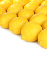 Ripe lemons on white background
