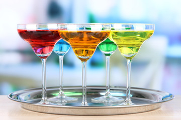 Different cocktails on bright background